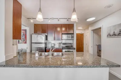 a kitchen with a sink and a counter top at Great Ocean Mountain & City views with one free parking in Vancouver