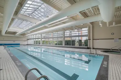 a large indoor swimming pool with a large ceiling at Great Ocean Mountain & City views with one free parking in Vancouver