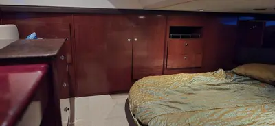 a bedroom with a bed and wooden cabinets at Fly Knots in Vancouver