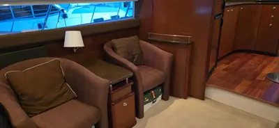 a small room with two chairs and a lamp at Fly Knots in Vancouver