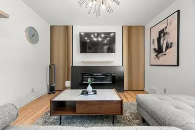 a living room with a couch and a coffee table at 3bd Luxury Home, Steps to Calgary DT, River, Hospital in Calgary