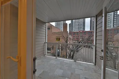 a balcony with a view of a building at Ice District 2 Kings Underground Park Patio in Edmonton