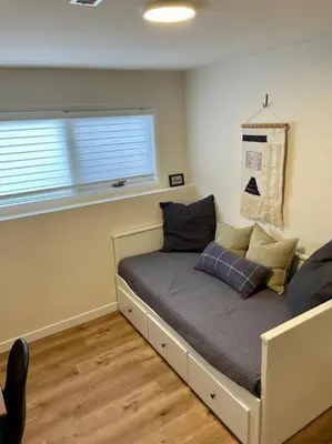 a bed in a room with a window at Nell's Mountain Lodge - Arcade Hottub Fire Pit 5 Acres in Golden
