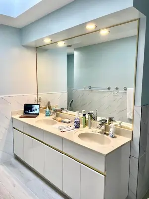 a bathroom with two sinks and a large mirror at Rose Garden Vancouver Airport - Richmond BC in Richmond