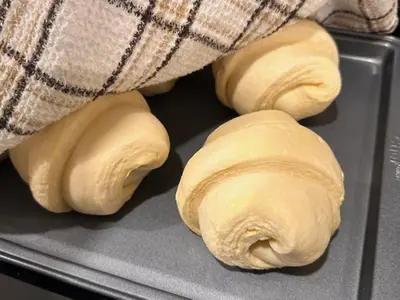 three rolls of bread sitting on a tray at The Grove B&B Mayne Island in Mayne Island