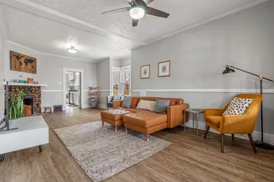 a living room with a couch and two chairs at Dinos Last Post - Family Friendly 4 Bedrooms in Drumheller