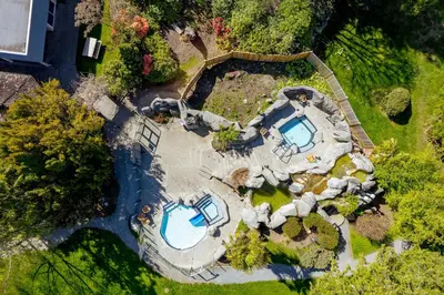 an overhead view of a house with a swimming pool at Beachside Townhouses at The Pacific Shores Strata Property in Nanoose Bay