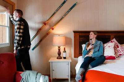 a man and a woman in a hotel room at Mount Engadine Lodge in Kananaskis Village