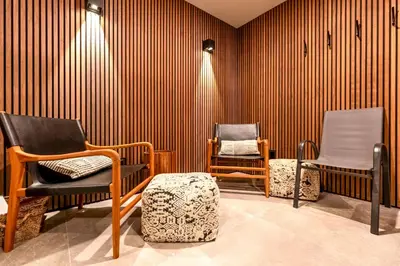 a room with two chairs in a room with striped walls at Alders Chalet by Fernie Central Reservations in Fernie