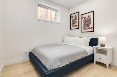 a bedroom with a bed and a window at Free Parking, Perfect Family Home with King Bed in Calgary