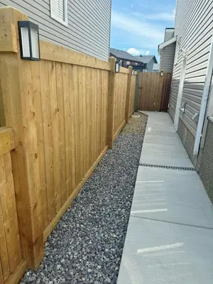 a wooden fence with a sidewalk next to a fence sidx sidx at 2 Bedroom Basement Suite in Edmonton