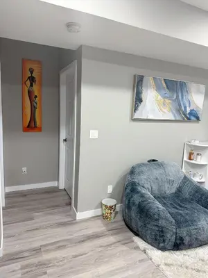 a bedroom with a large bed in the corner at 2 Bedroom Basement Suite in Edmonton