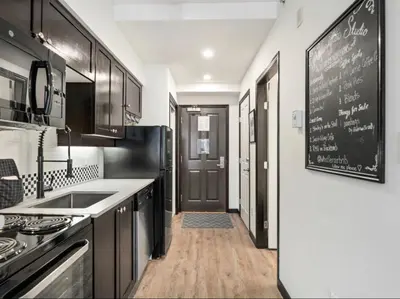 a kitchen with a chalkboard on the wall at Ideal Central Village Location! in Whistler