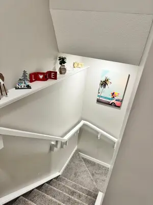 a white staircase with white shelves in a room at Tee's Oasis in Calgary