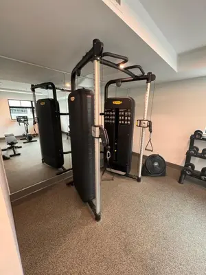 a gym with several tread machines in a room at RED Mountain Gem in Trail