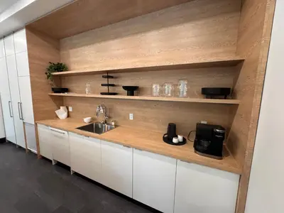 a kitchen with white cabinets and a sink at Premium RED Mountain Lodging in Trail