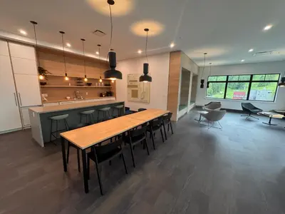 a kitchen with wooden tables and chairs in a room at Premium RED Mountain Lodging in Trail