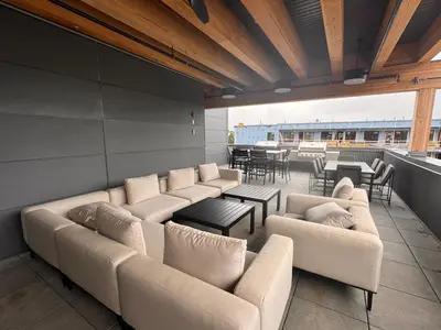 a living room with couches and tables and tablesktop at Premium RED Mountain Lodging in Trail
