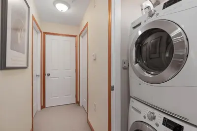 a laundry room with a washer and dryer at Nicklaus North - Clubhouse by Whistler Premier in Whistler