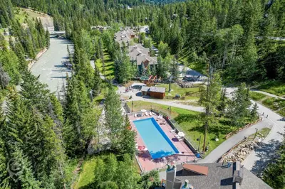 an aerial view of a resort with a swimming pool at Toby Creek Lodge by StayIn in Panorama