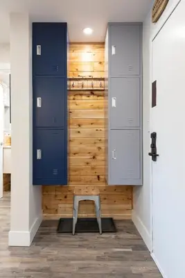 a closet with blue cabinets and a stool in a room at Whistler Village Center - Newly Renovated Condo in Whistler