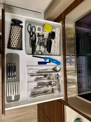 a drawer filled with utensils in a kitchen at Century Park Condo Oasis in Edmonton