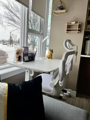 a hospital room with a chair and a table at Century Park Condo Oasis in Edmonton