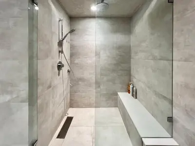a bathroom with a shower with a tub and a sink at Cozy&Private Suite in Vancouver in Vancouver