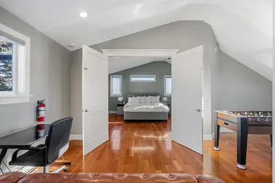 a bedroom with a bed and a desk at Home Alone Retreat in Calgary
