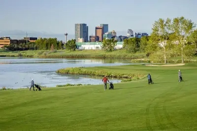 a group of people playing golf on a golf course at Near Downtown, Large 3BR! FREE Banff Pass in Calgary