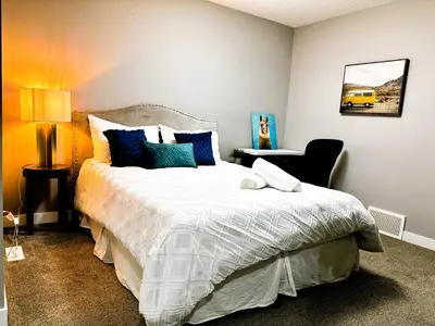 a bedroom with a bed and a yellow bus at Luxury family vacation rental in Laurel Edmonton in Edmonton