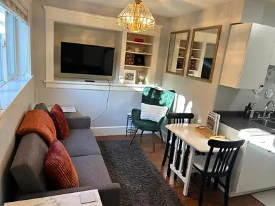 a living room with a couch and a table at Garden Suite in Colwood in Victoria