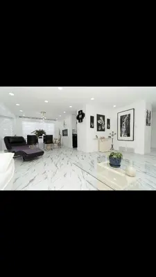 a large living room with a couch and a table at Modern and luxury 3500 sq feet house jetted tub over 10000 sq feet lot in Edmonton