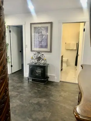 a living room with a fireplace and a bathroom at Modern and luxury 3500 sq feet house jetted tub over 10000 sq feet lot in Edmonton