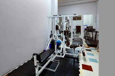 a gym with several tread machines in a room at Two-Story Loft with a High-rises view and Rooftop Deck in Vancouver