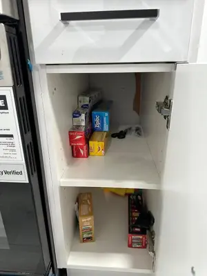a refrigerator door is open with food in it at Muaysh Cozy Family suite - Londonderry Mall in Edmonton