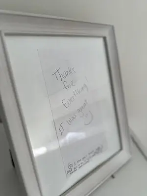 a framed picture of a thank you sign in a window at Westshore Garden Escape in Victoria