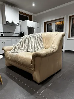 a couch sitting in a living room in a kitchen at Luxury Vancouver Suite Near YVR and Downtown in Vancouver