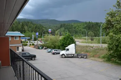 a white truck parked in a parking lot at Canadas Best Value Inn & Suites-Castlegar in Castlegar