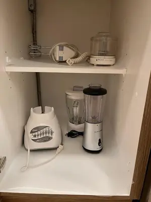 a kitchen shelf with a blender and other appliances at Luxurious, Centrally Located Home in Cavanagh in Edmonton