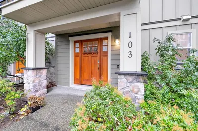 a front door of a house with a wooden door at Home away from Home in Victoria