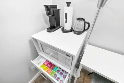 an open refrigerator with its door open at Home away from Home in Victoria