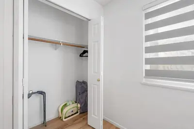 a hallway with a white door and a window at Spacious Family Retreat Central to YVR and Downtown in Vancouver