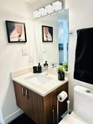 a bathroom with a sink and a toilet at Beautiful condo beach side Yaletown in Vancouver