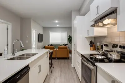 a kitchen with a sink and a counter top at Free Parking, Pet Friendly, Close to DT in Calgary