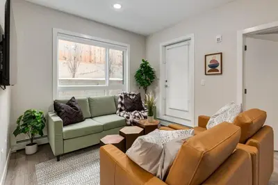 a living room with a couch and a table at Free Parking, Pet Friendly, Close to DT in Calgary