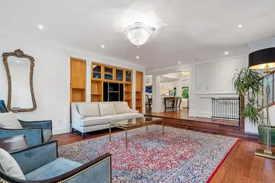 a living room with a couch and a table at Elegant West Vancouver Estate with Ocean Views in West Vancouver