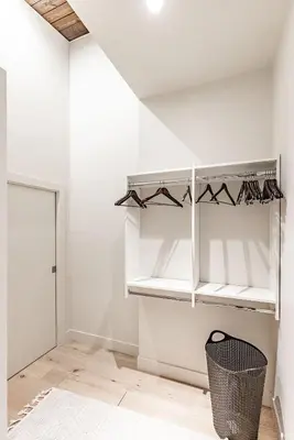a room with white walls and white shelves at Large Modern Home in Squamish in Squamish