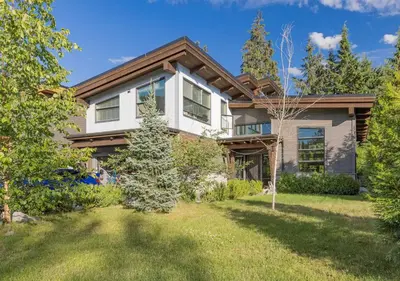 a large white house with a yard at Large Modern Home in Squamish in Squamish