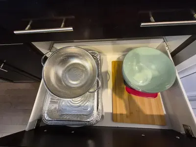 a kitchen with a strainer and a pot and bowl at Sean Comfy Home in Edmonton